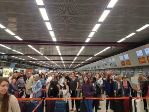 Long queues at the airport check-in desks due to staff shortages after the pandemic